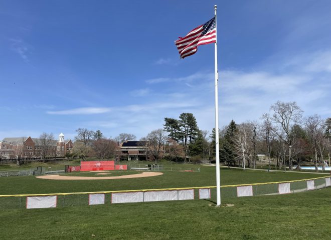 baseball field with American flag on flag pole